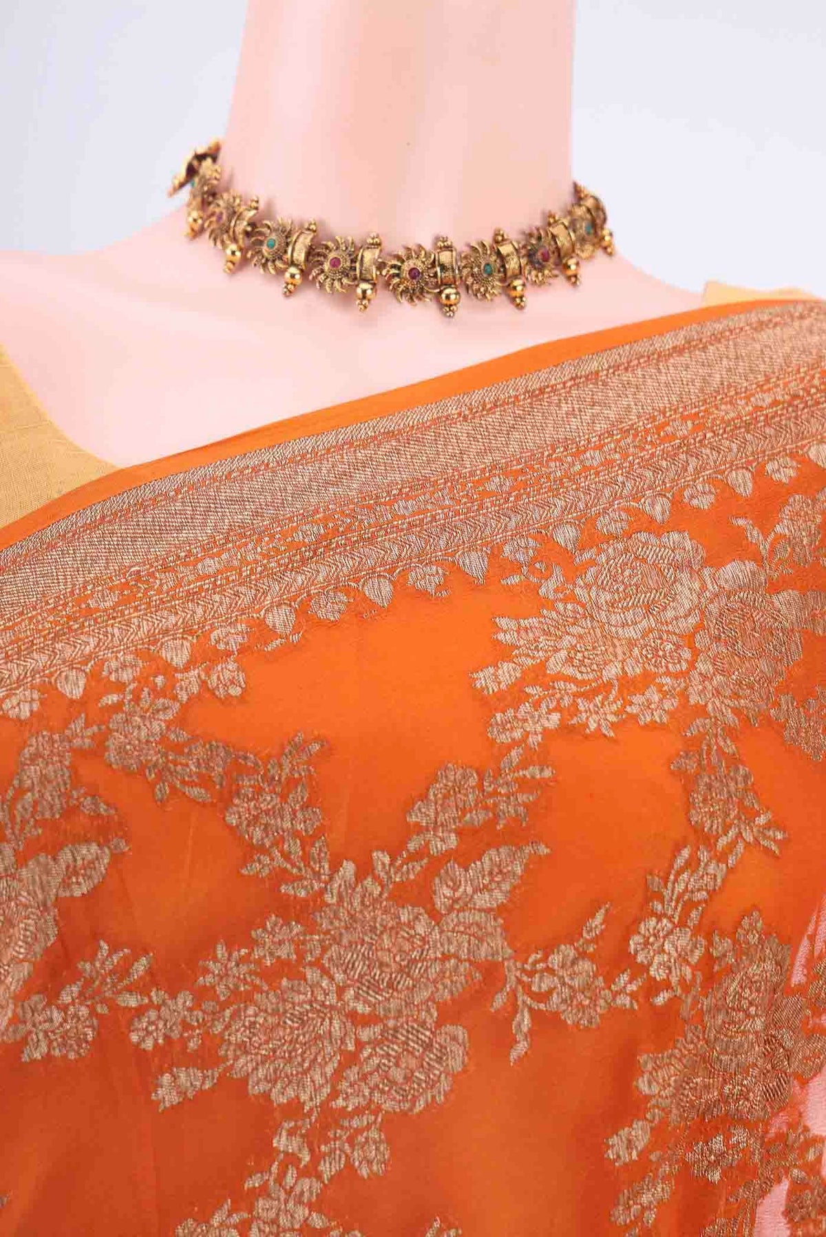 Border image of Rust Banarasi Georgette Saree with Zari Brocade on the body and Zari Border