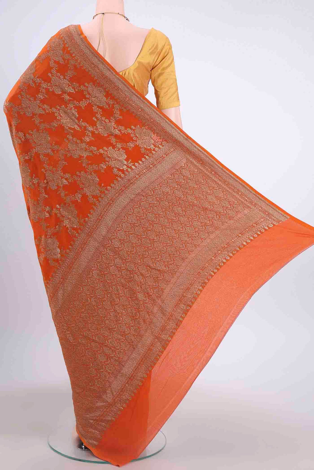 Flat view of Rust Banarasi Georgette Saree with Zari Brocade on the body and Zari Border