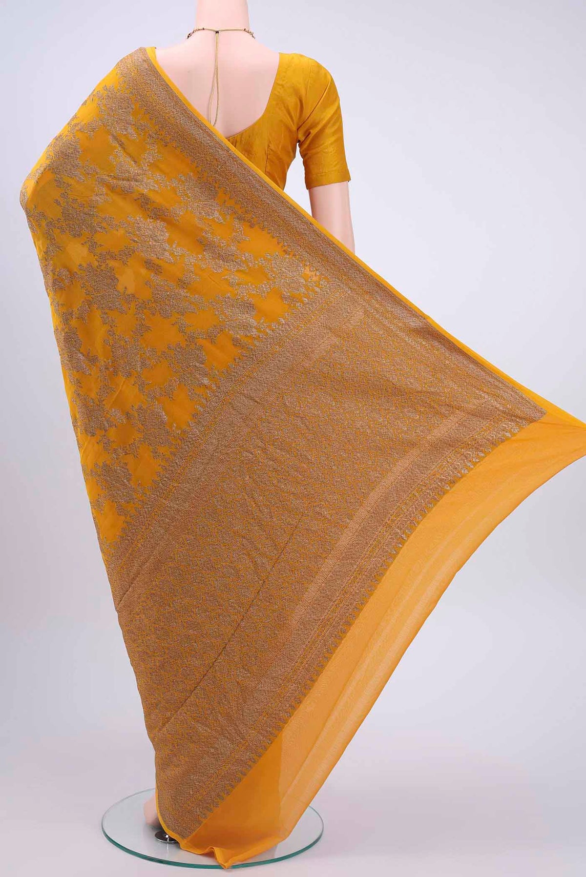 Flat view of Mustard Banarasi Georgette Saree with Zari Butta on the body and Zari Border