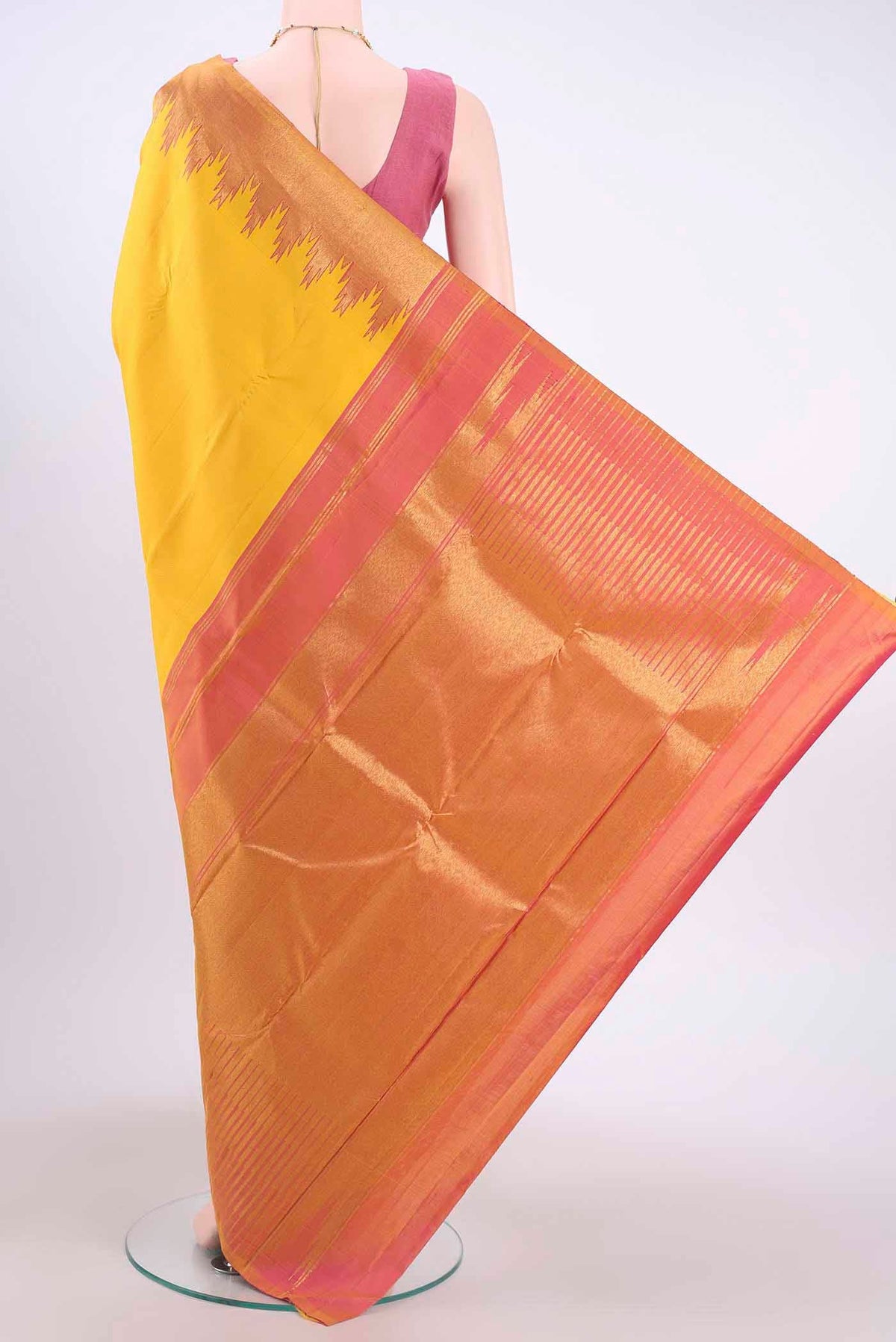 Flat view of Yellow Kanchipuram Saree with Plain Body and Temple Border