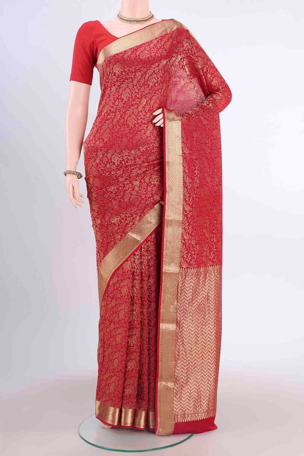 Red Mysore Crepe Saree with Zari Brocade on the body and Zari Border displayed on a mannequin