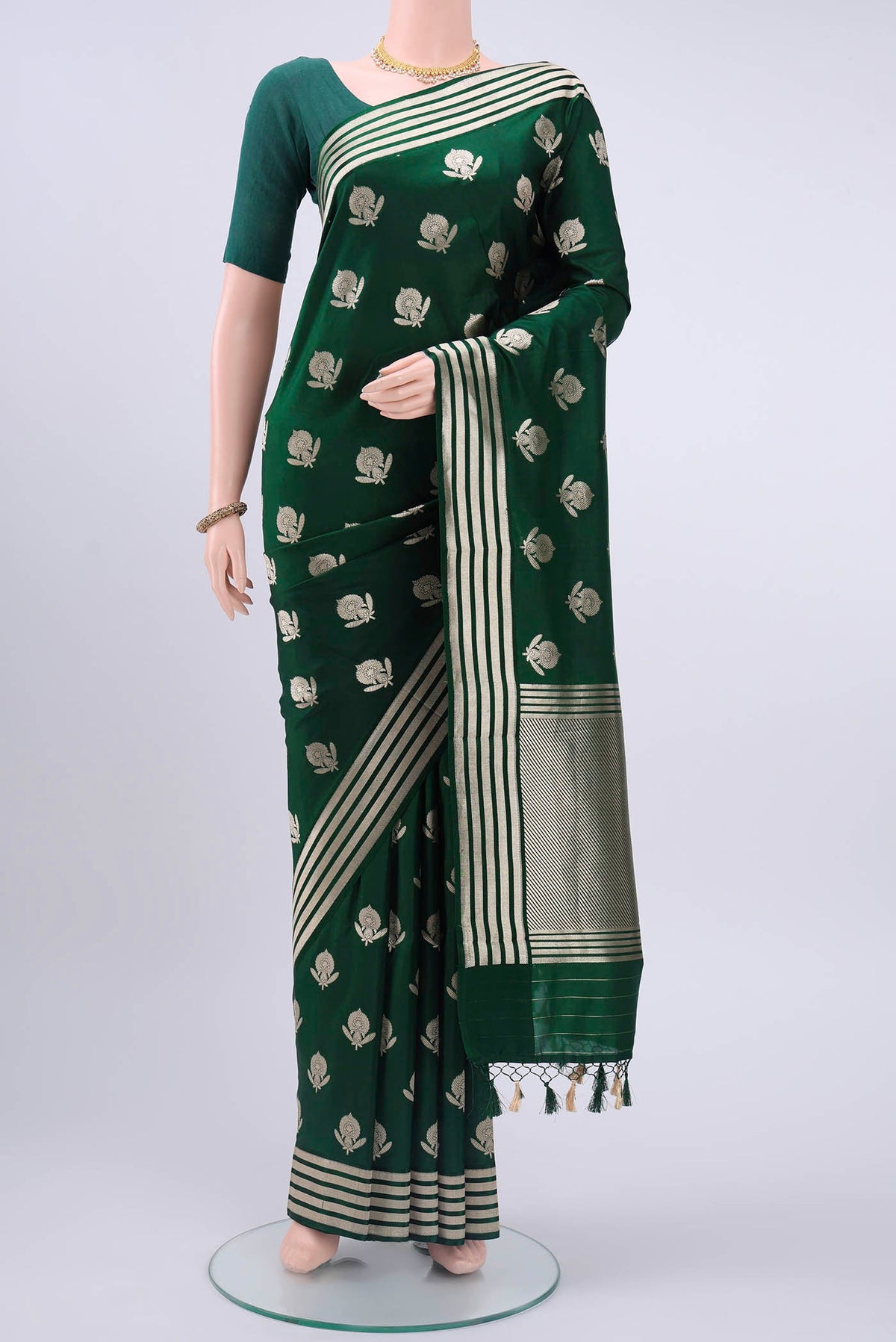 Bottle Green Dual Tone Banarasi Silk Saree with Zari Butta on the body and Zari Border displayed on a mannequin