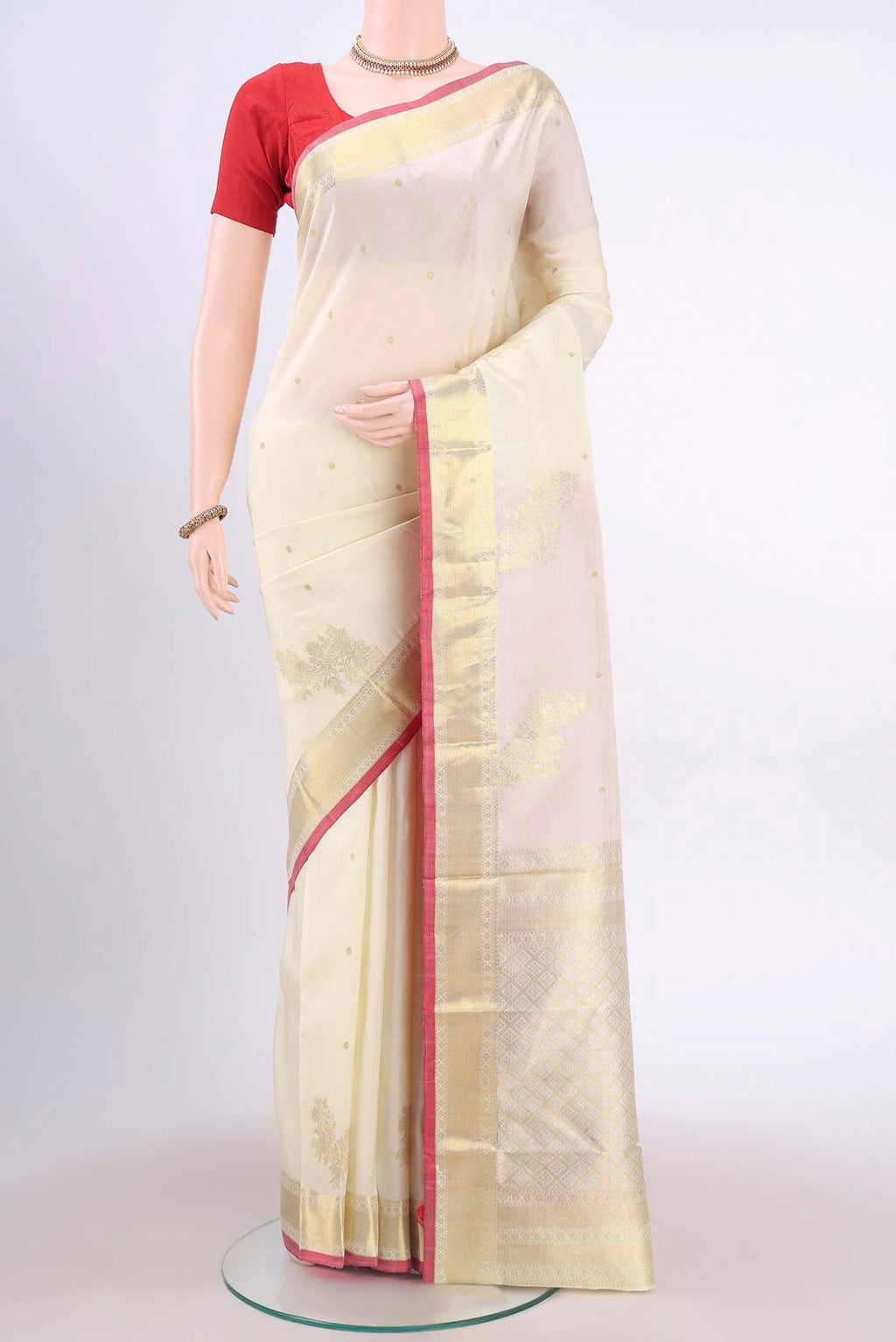 Off White Dual Tone Kanchipuram Saree with Zari Brocade on the body and Zari Border displayed on a mannequin