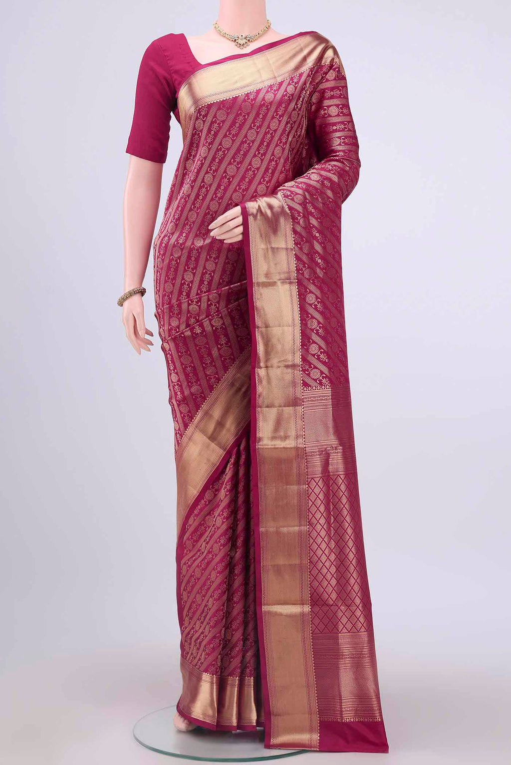 Rani Pink Soft Silk Saree with Zari Brocade on the body and Zari Border displayed on a mannequin