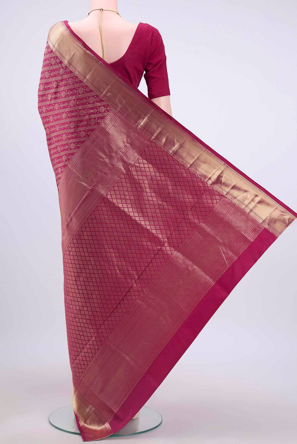Flat view of Rani Pink Soft Silk Saree with Zari Brocade on the body and Zari Border