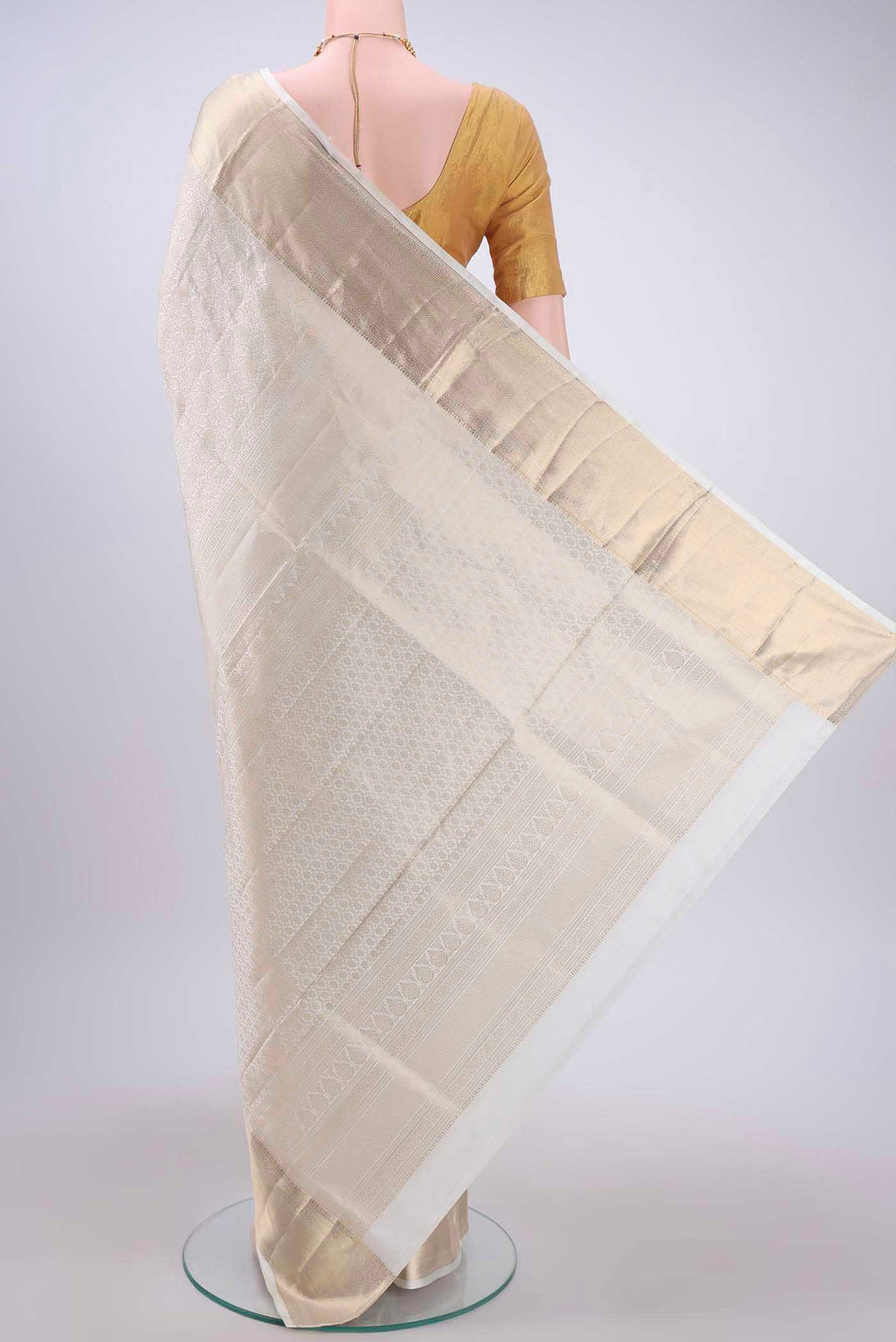 Flat view of Off White Soft Silk Saree with Zari Brocade on the body and Zari Border