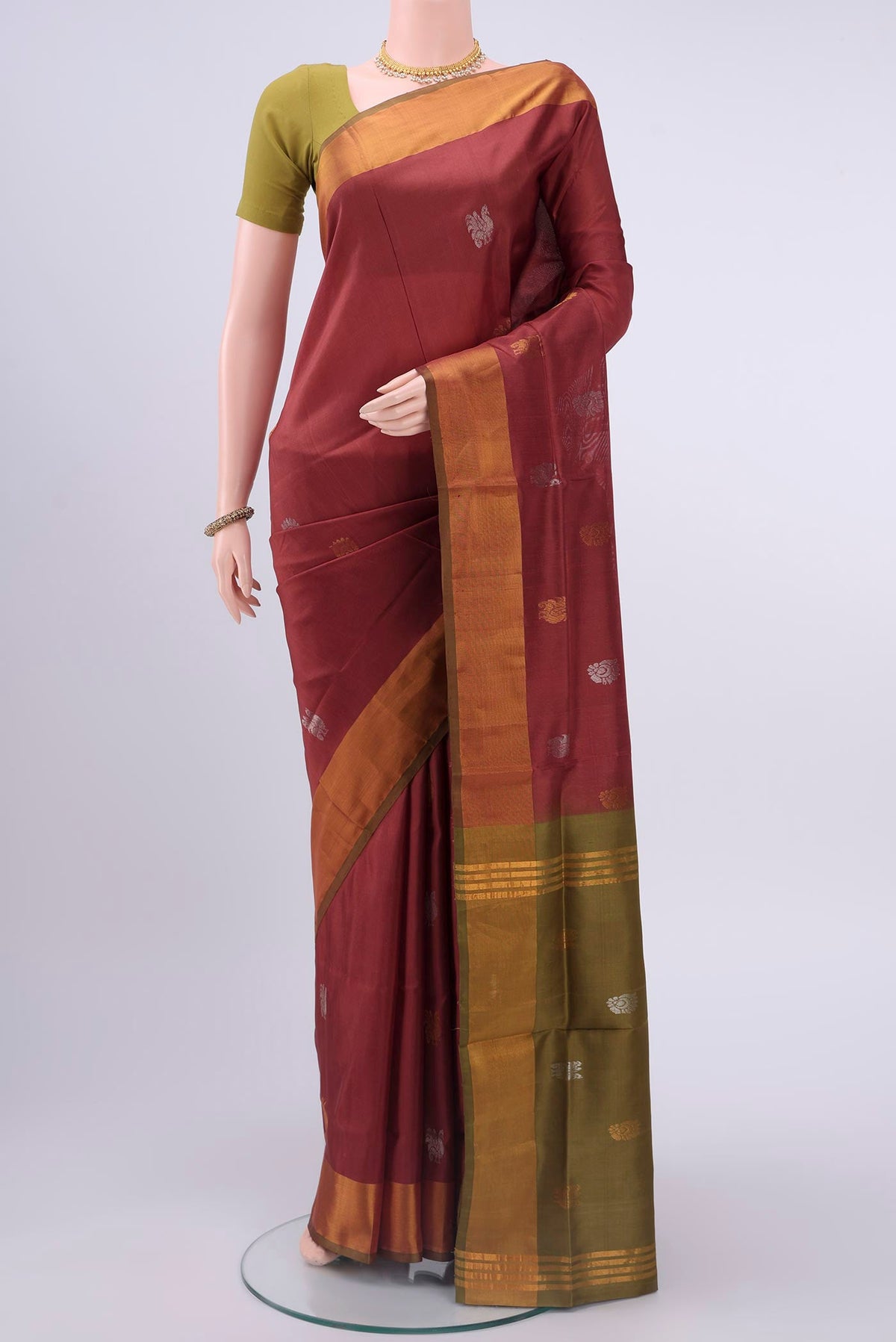Maroon Uppada Silk Saree with Zari Butta on the body and Zari Border displayed on a mannequin