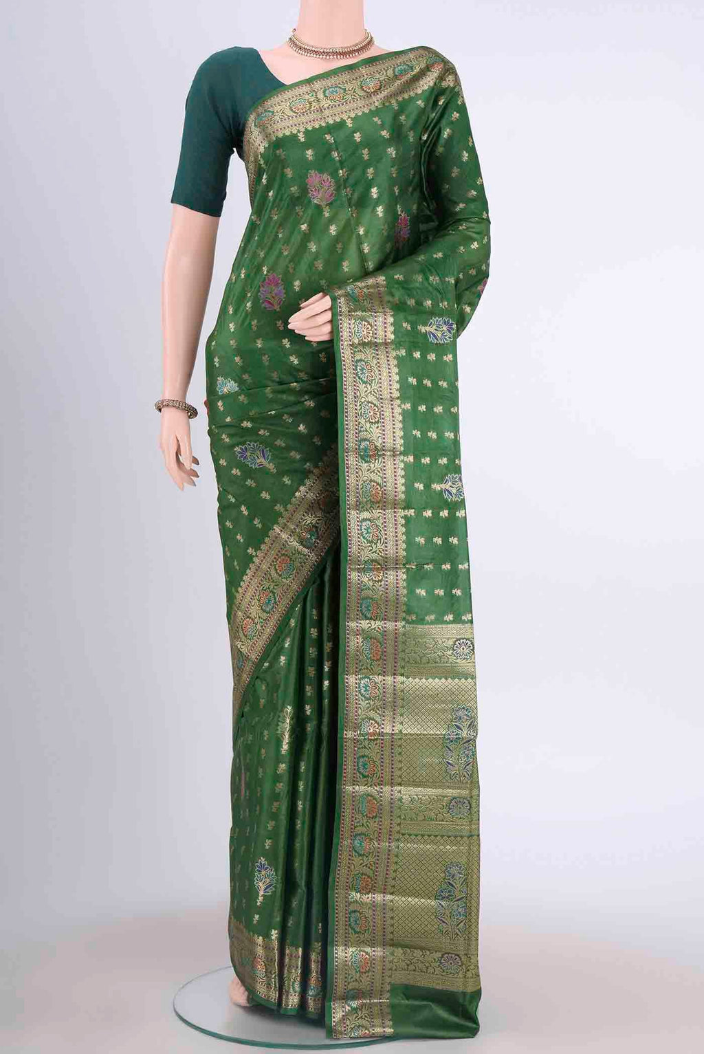 Green Banarasi Tussar Silk Saree with Zari And Thread Butta on the body and Zari And Thread Border displayed on a mannequin