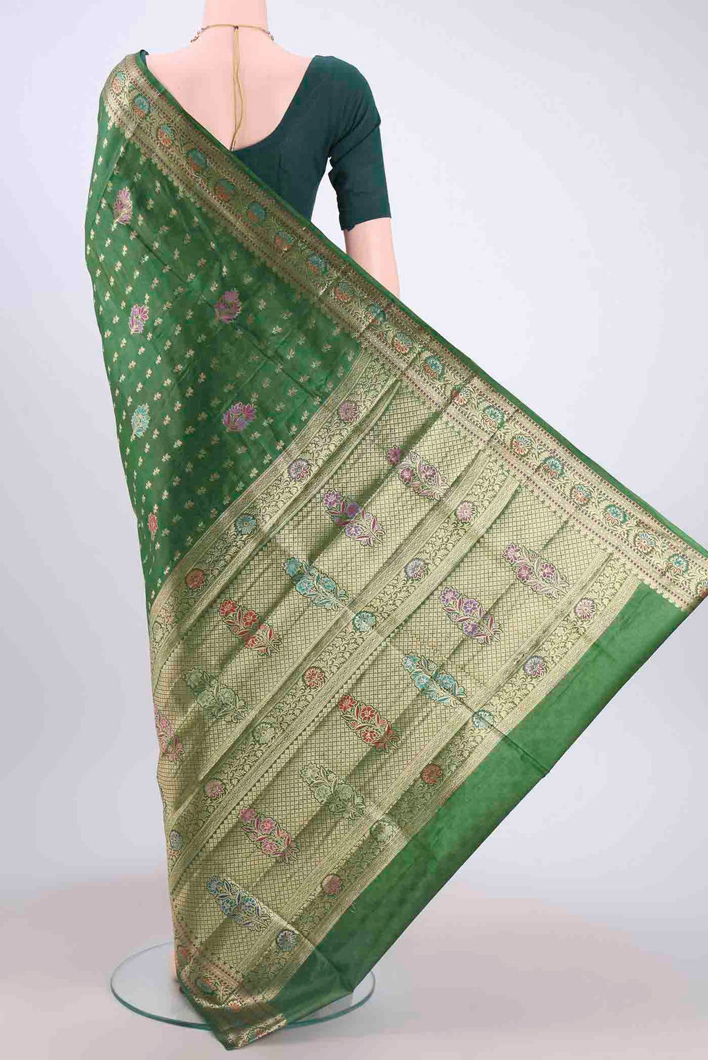 Flat view of Green Banarasi Tussar Silk Saree with Zari And Thread Butta on the body and Zari And Thread Border