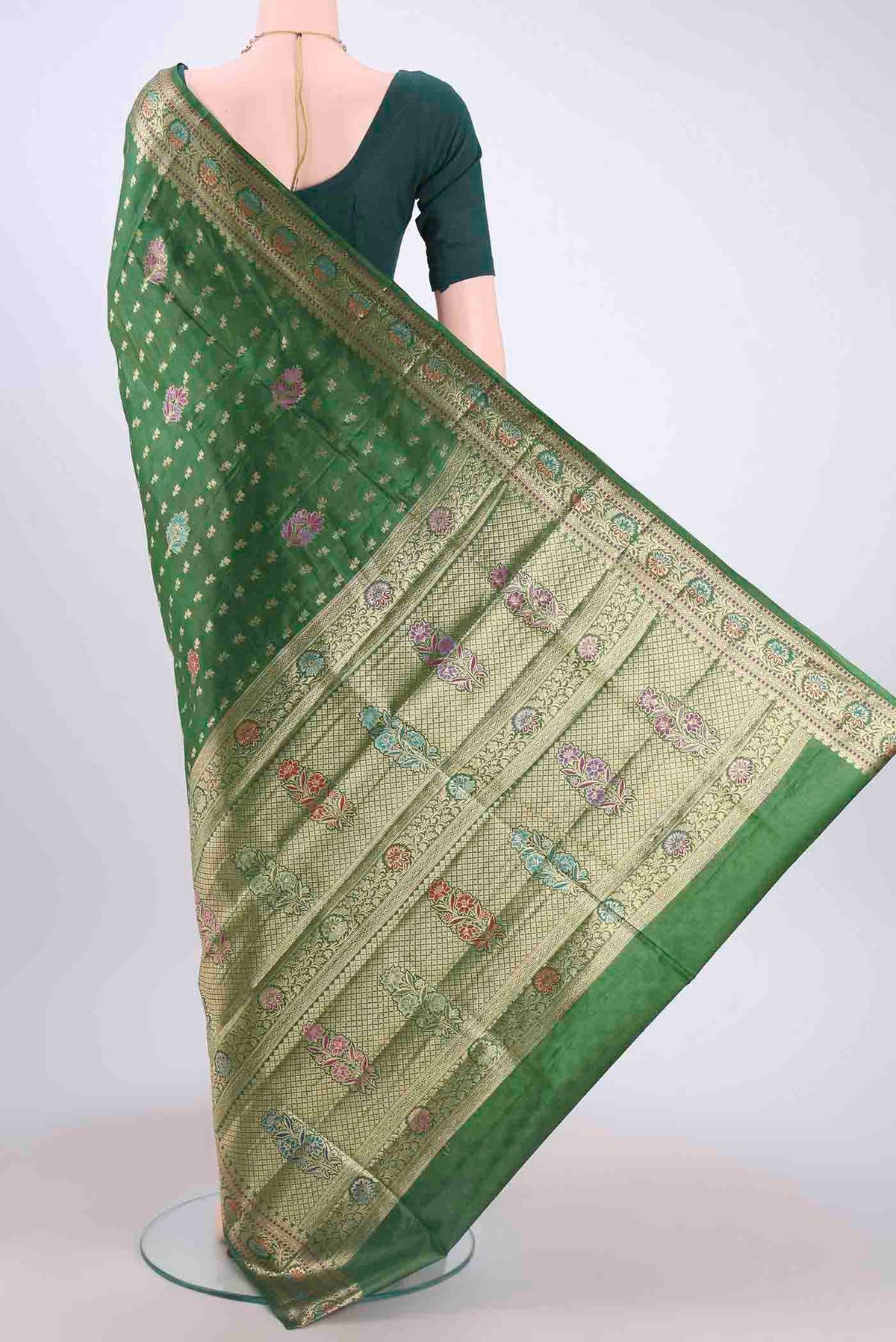 Flat view of Green Banarasi Tussar Silk Saree with Zari And Thread Butta on the body and Zari And Thread Border