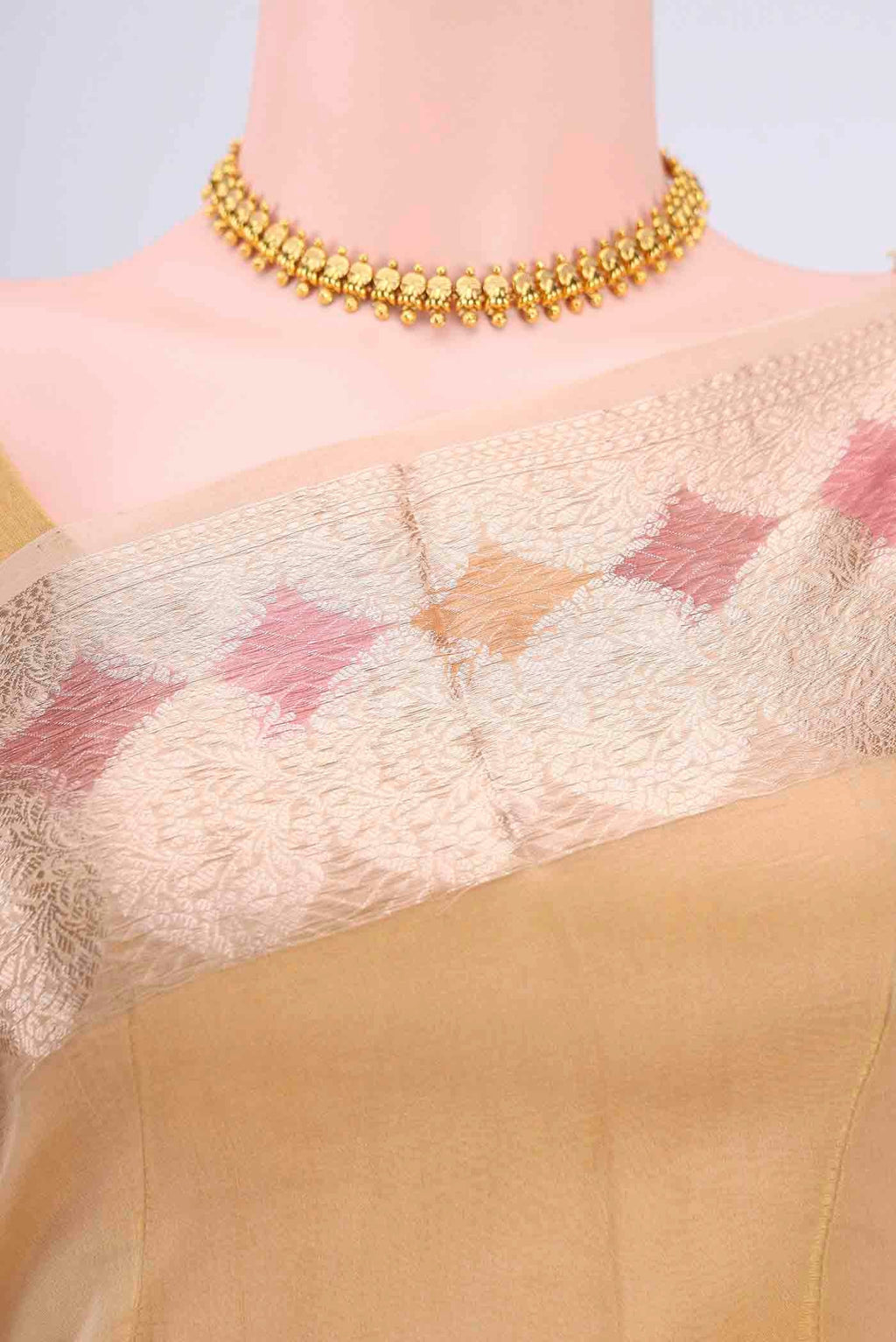 Border image of Beige Organza Silk Saree with Zari Butta on the body and Zari Border