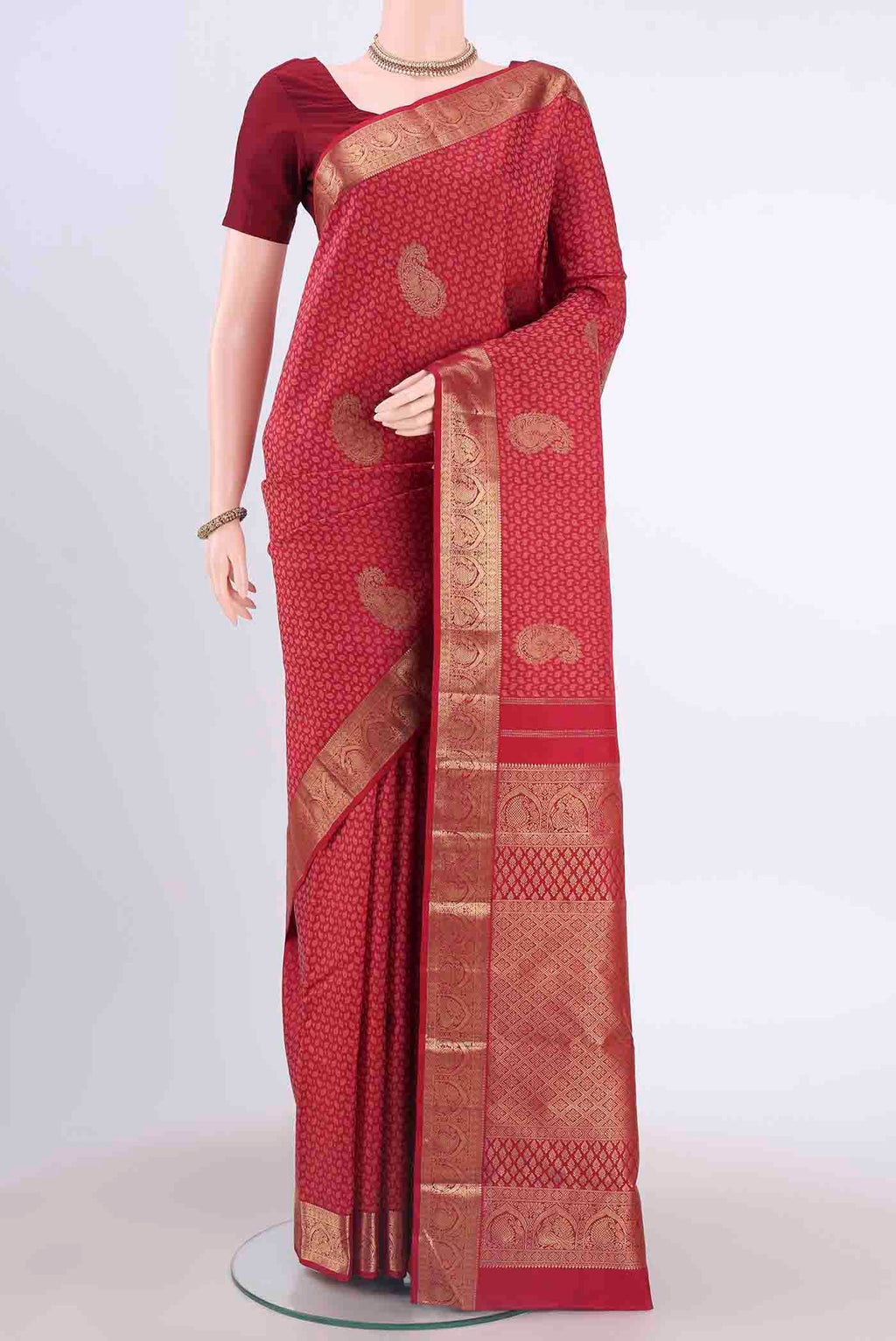 Pure Silk Pure Zari Red Kanchipuram Saree with Jacquard With Zari Butta on the body and Zari Border displayed on a mannequin