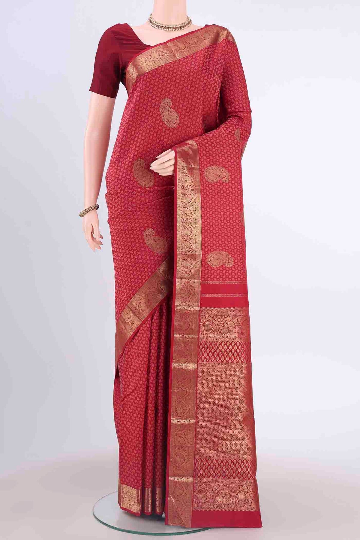Pure Silk Pure Zari Red Kanchipuram Saree with Jacquard With Zari Butta on the body and Zari Border displayed on a mannequin