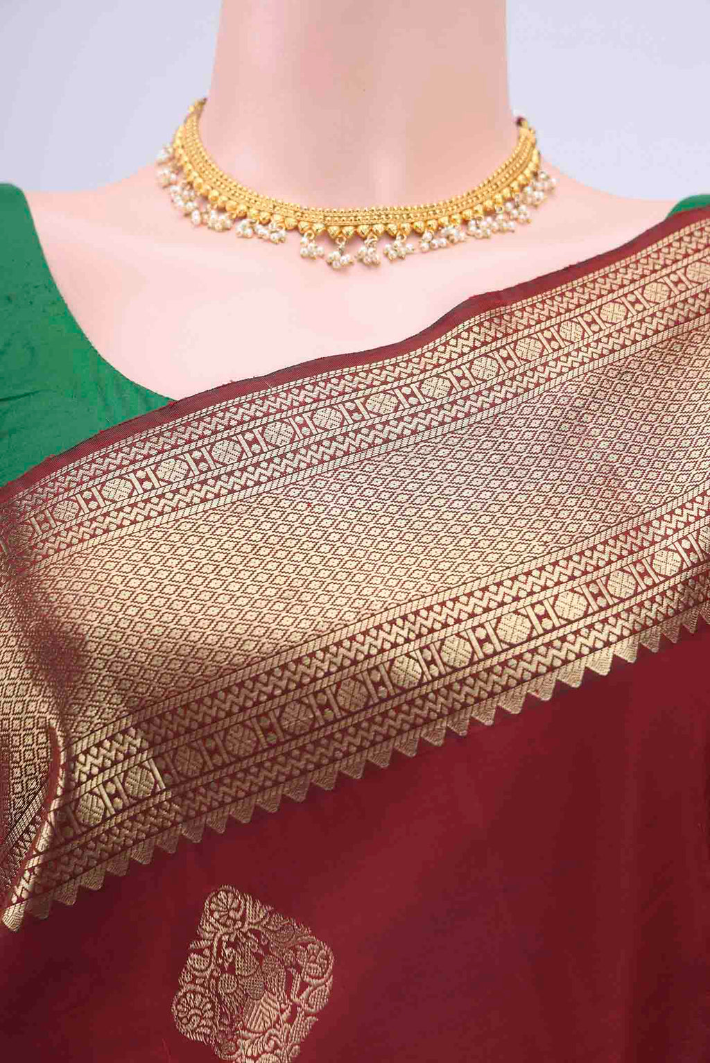Border image of Maroon Kanchipuram Saree with Zari Butta on the body and Zari Border