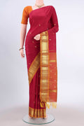 Maroon Kanchipuram Silk Saree with Zari Butta on the body and One Side Border displayed on a mannequin