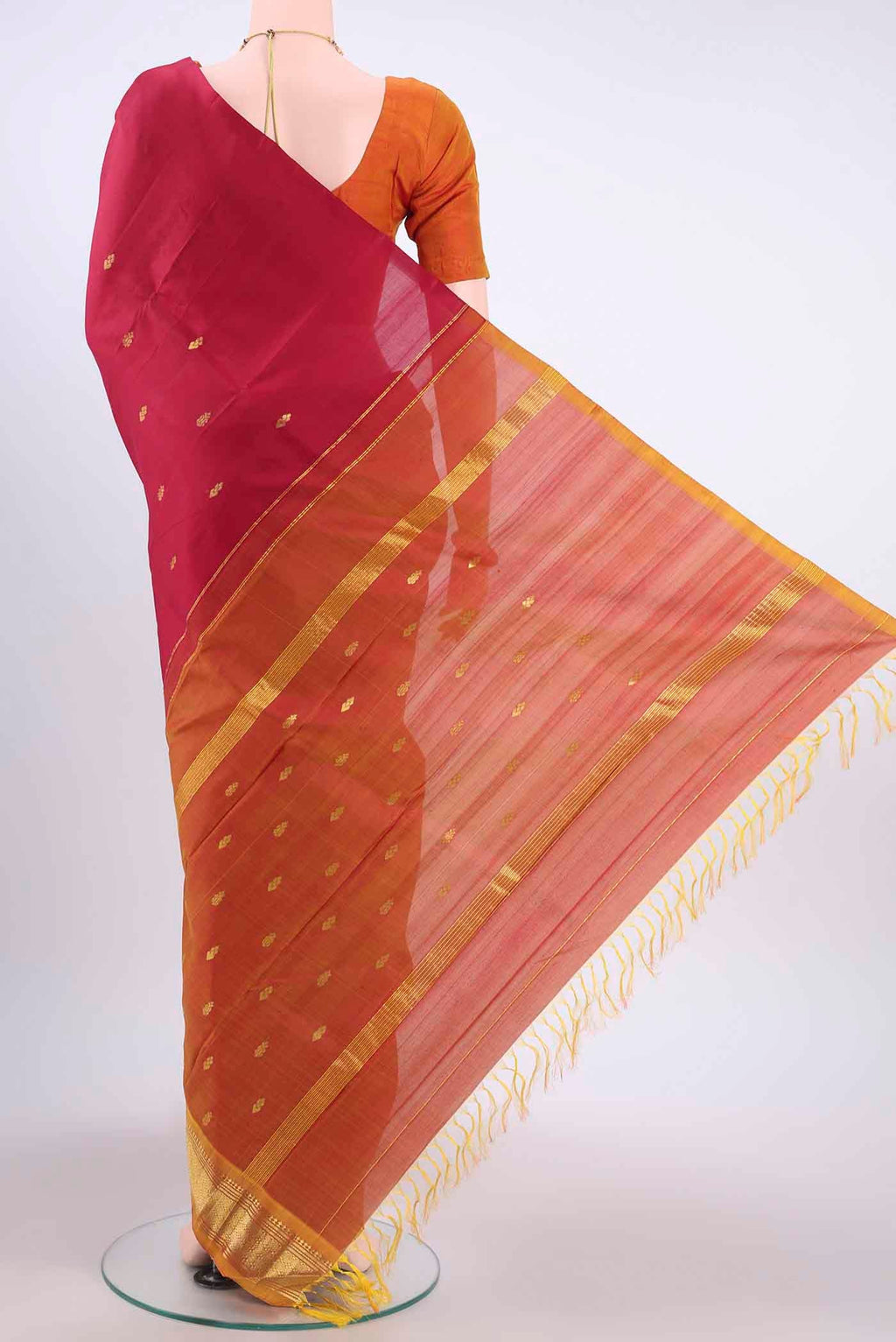 Flat view of Maroon Kanchipuram Silk Saree with Zari Butta on the body and One Side Border