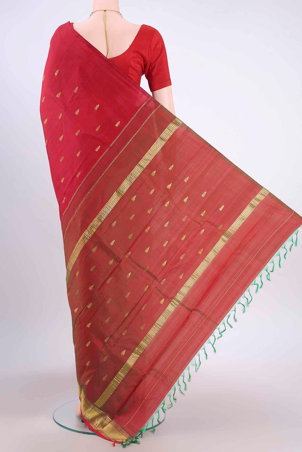 Flat view of Red Kanchipuram Silk Saree with Zari Butta on the body and One Side Border