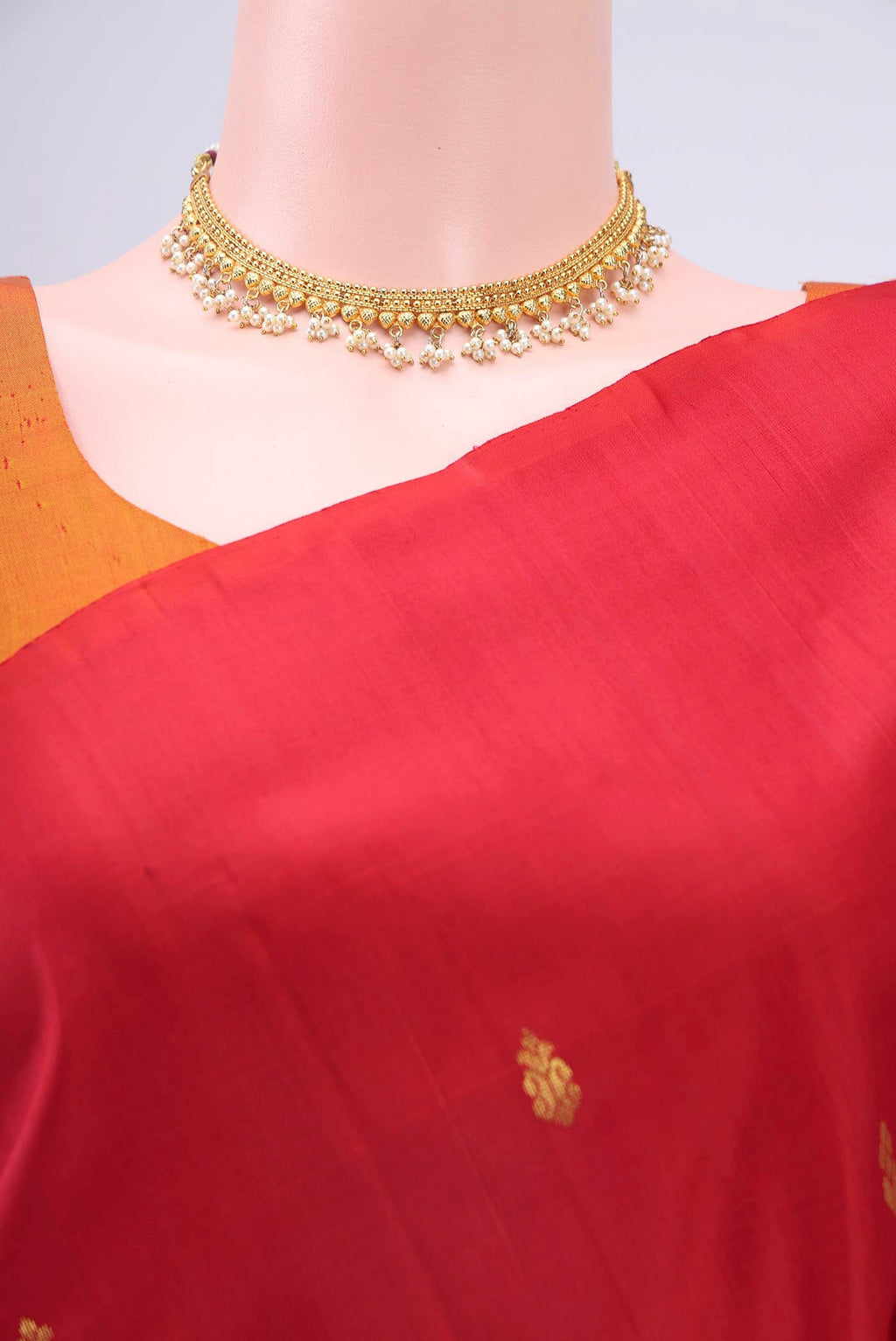 Border image of Red Kanchipuram Silk Saree with Zari Butta on the body and One Side Border