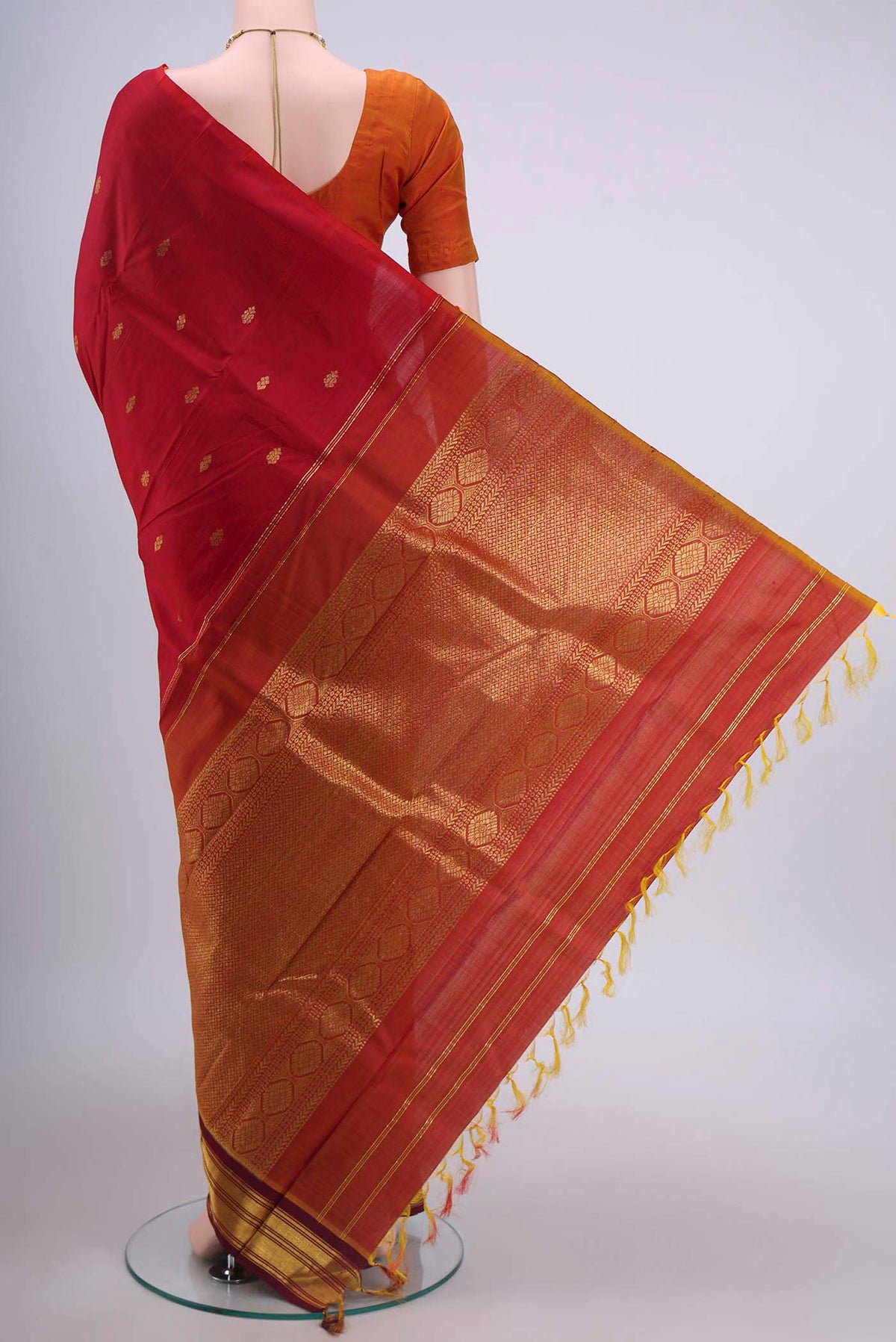 Flat view of Red Kanchipuram Silk Saree with Zari Butta on the body and One Side Border
