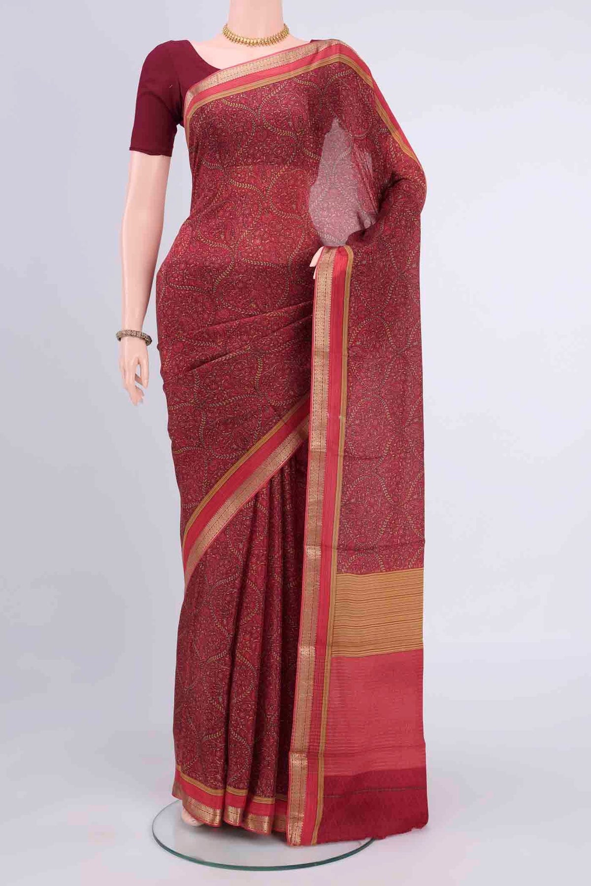 Magenta Mysore Crepe Saree with Floral Print on the body and Zari Border displayed on a mannequin
