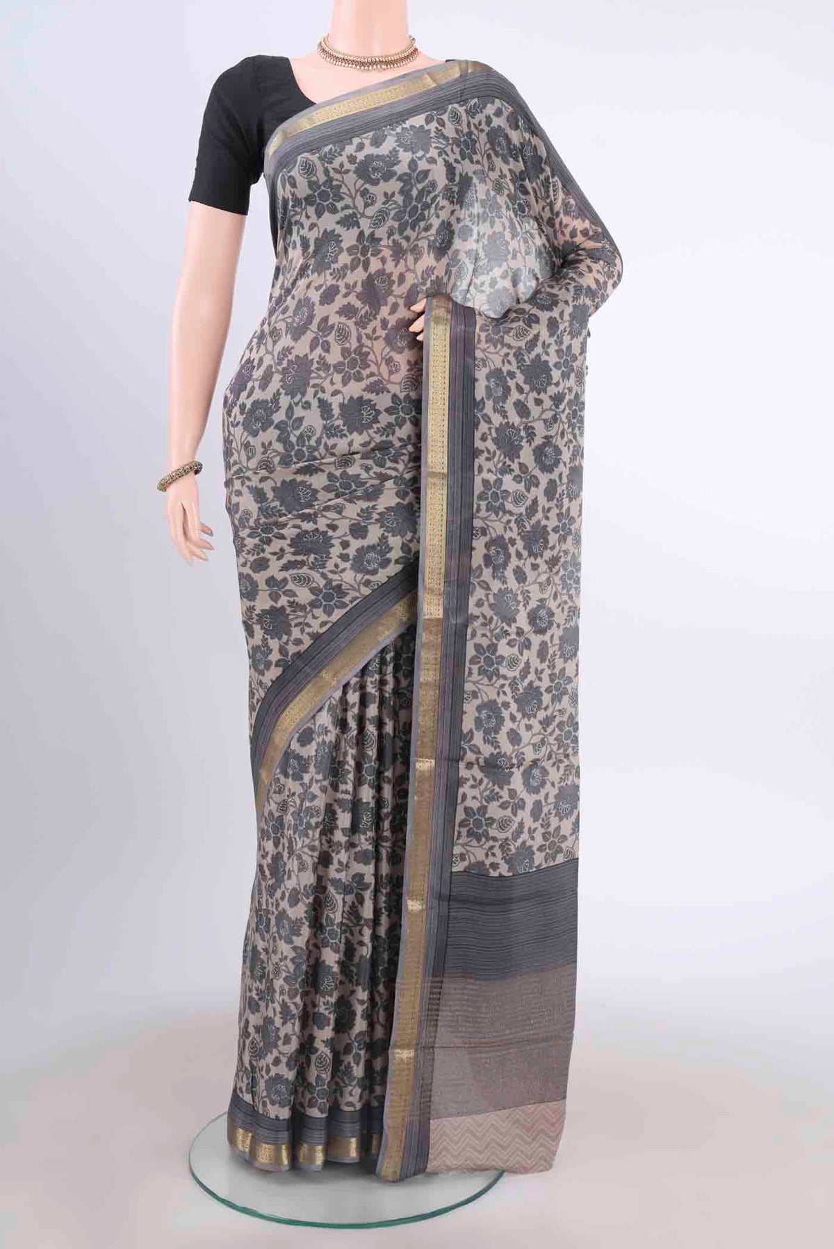 Davys Grey Mysore Crepe Saree with Floral Print on the body and Printed Border displayed on a mannequin