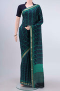 Navy Blue Mysore Crepe Saree with Floral Print on the body and Zari Border displayed on a mannequin
