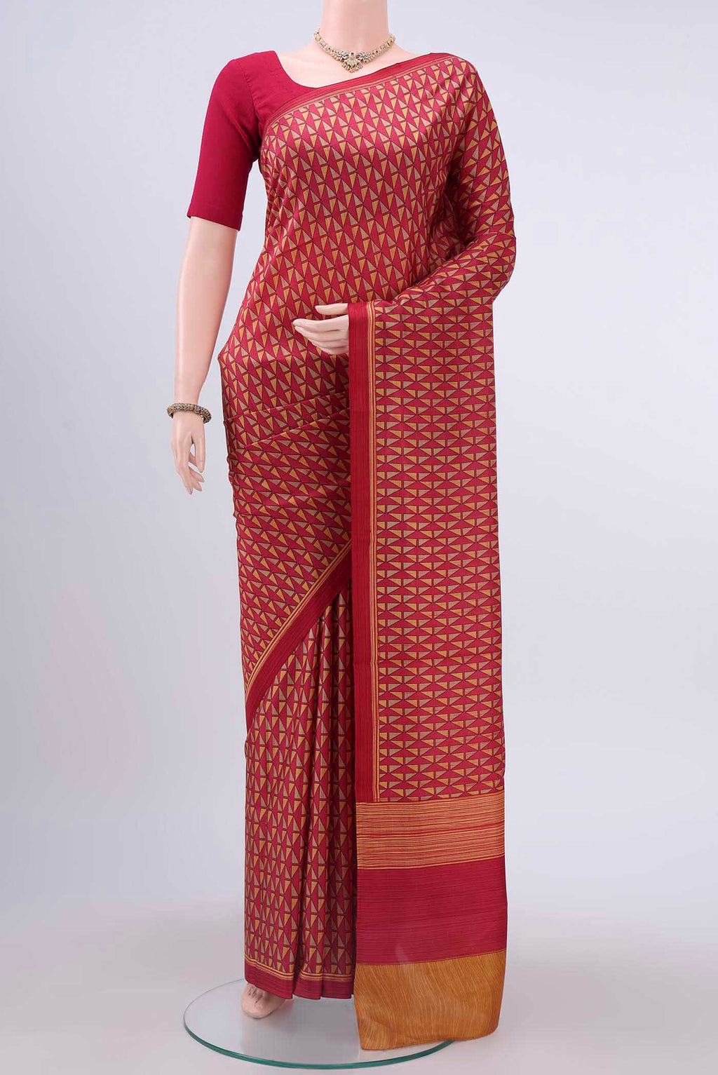 Pink Printed Silk Saree with Zari Brocade on the body and Zari Border displayed on a mannequin