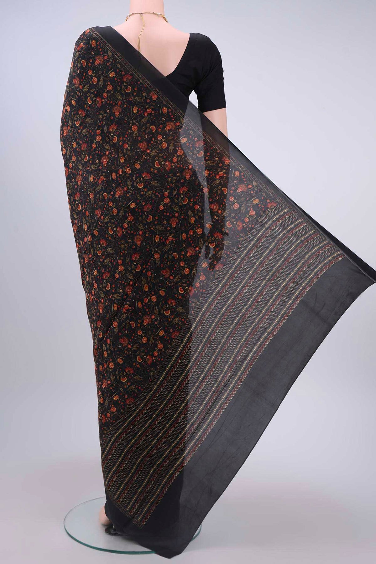 Flat view of Black Printed Silk Saree with Printed design on the body and Lace Border