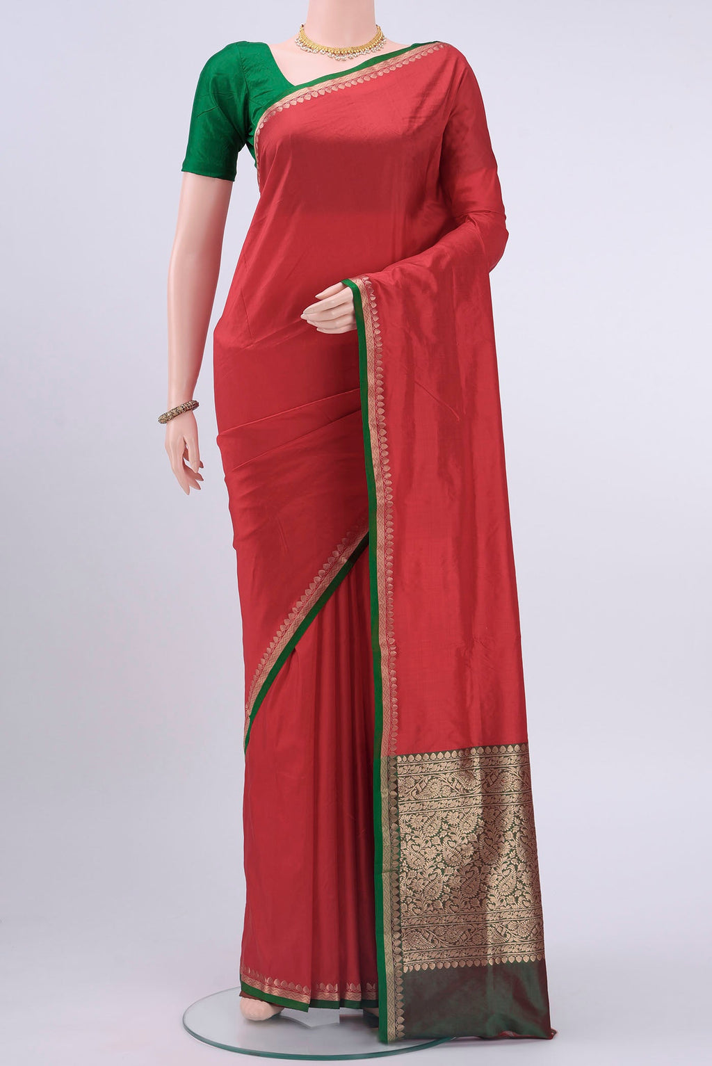 Red Banarasi Katan Silk Saree with Plain Body and Zari Border displayed on a mannequin