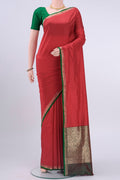 Red Banarasi Katan Silk Saree with Plain Body and Zari Border displayed on a mannequin