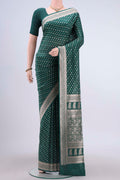 Green Banarasi Silk Saree with Zari Butta on the body and Zari Border displayed on a mannequin