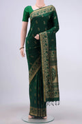 Green Soft Silk Saree with Jacquard design on the body and Thread Border displayed on a mannequin