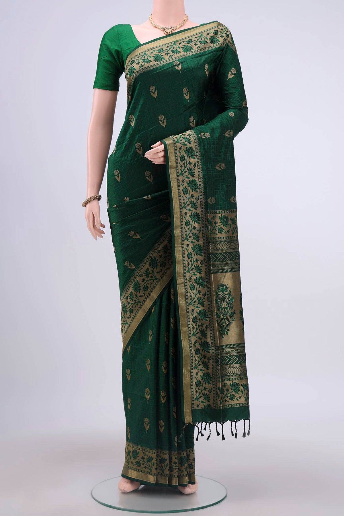 Green Soft Silk Saree with Jacquard design on the body and Thread Border displayed on a mannequin