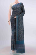 Dark Blue Printed Silk Saree with Floral Print on the body and Plain Border displayed on a mannequin