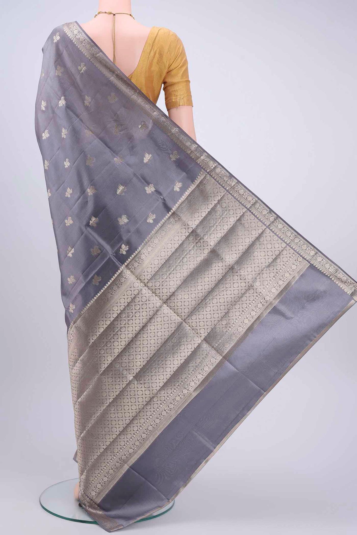 Flat view of Grey Banarasi Raw Silk Saree with Zari Butta on the body and Zari Border