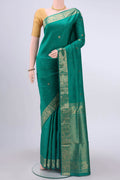Green Soft Silk Saree with Jacquard With Zari Butta on the body and Zari Border displayed on a mannequin