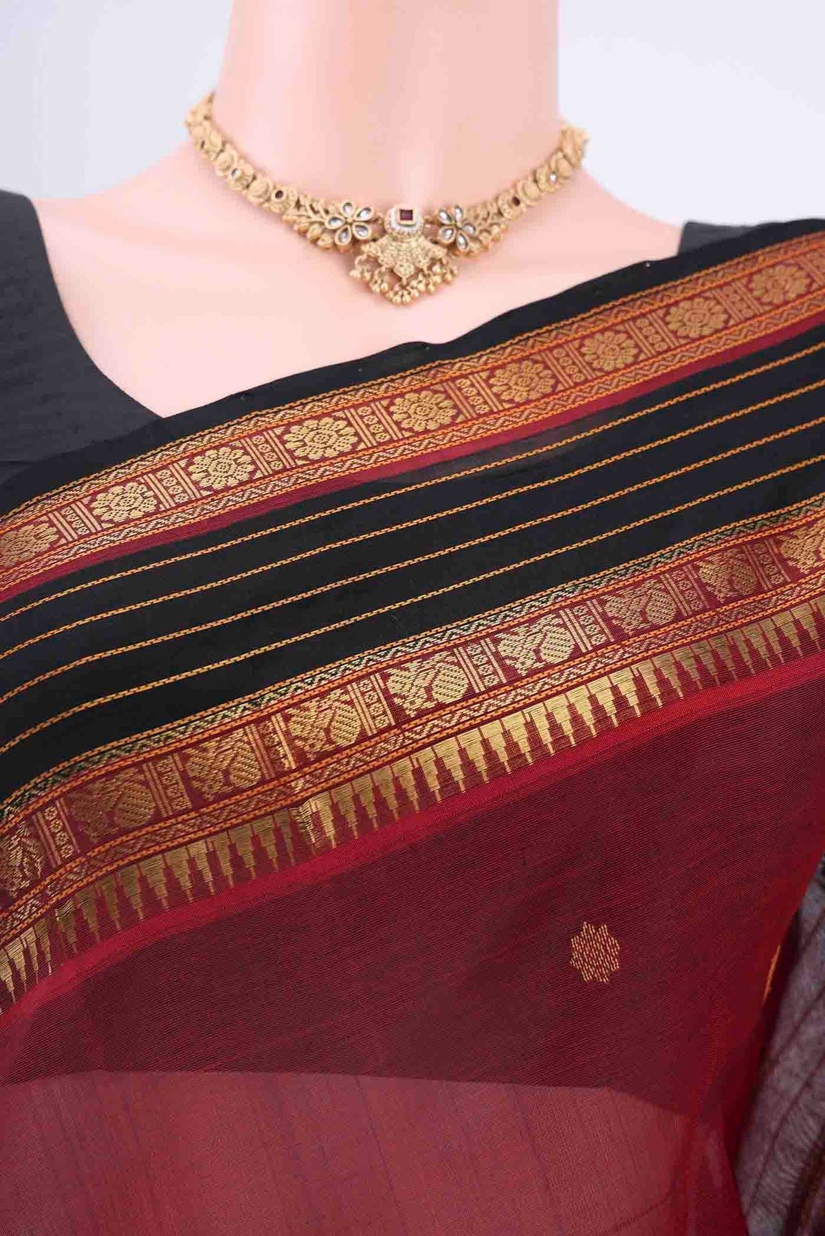 Border image of Maroon Silk Cotton Saree with Zari Butta on the body and Zari Border
