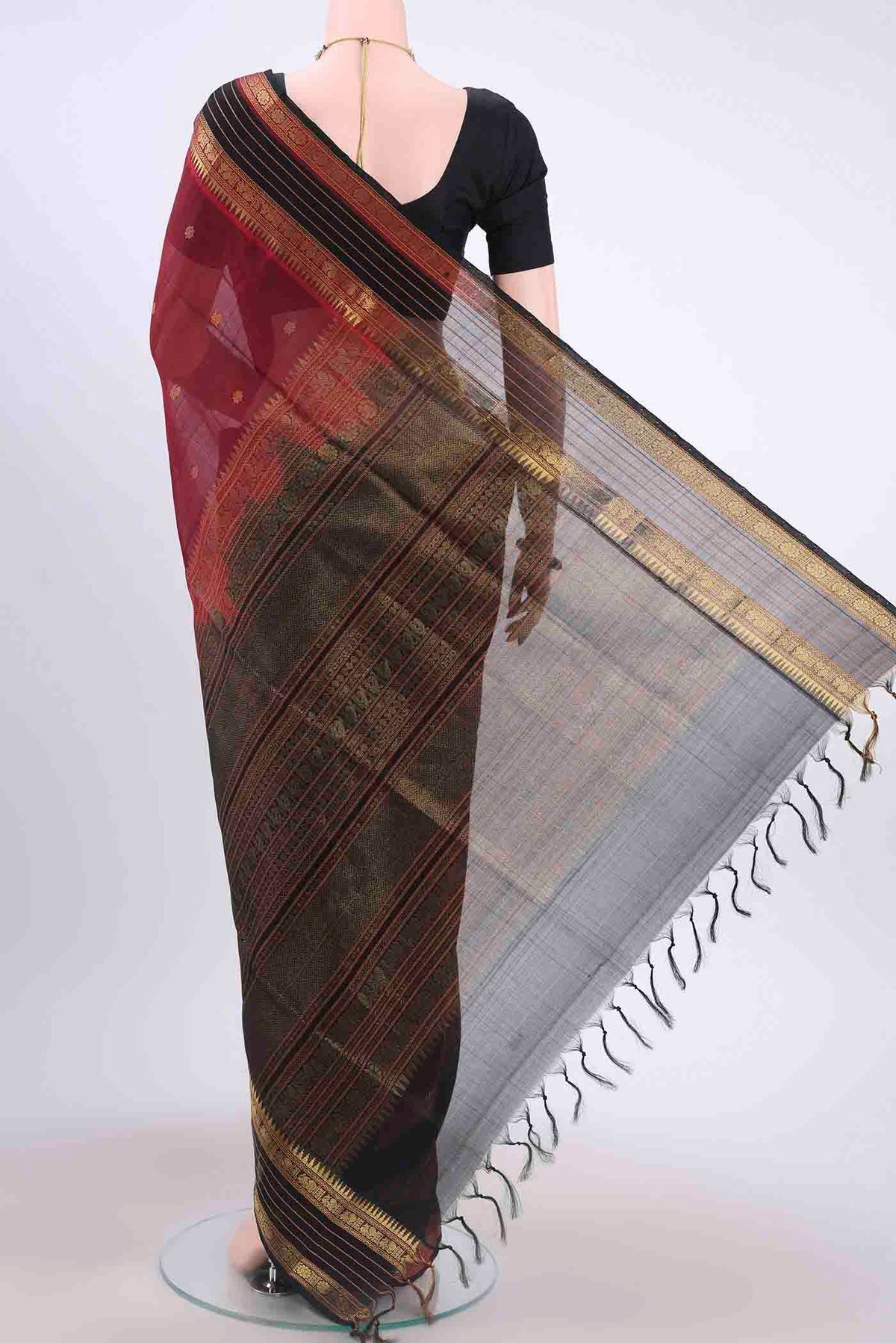 Flat view of Maroon Silk Cotton Saree with Zari Butta on the body and Zari Border