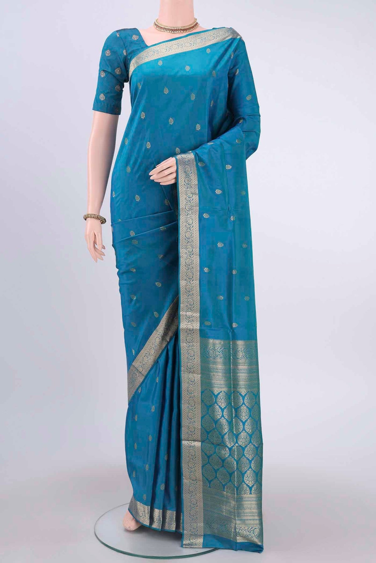 Blue Dual Tone Soft Silk Saree with Zari Butta on the body and Zari Border displayed on a mannequin