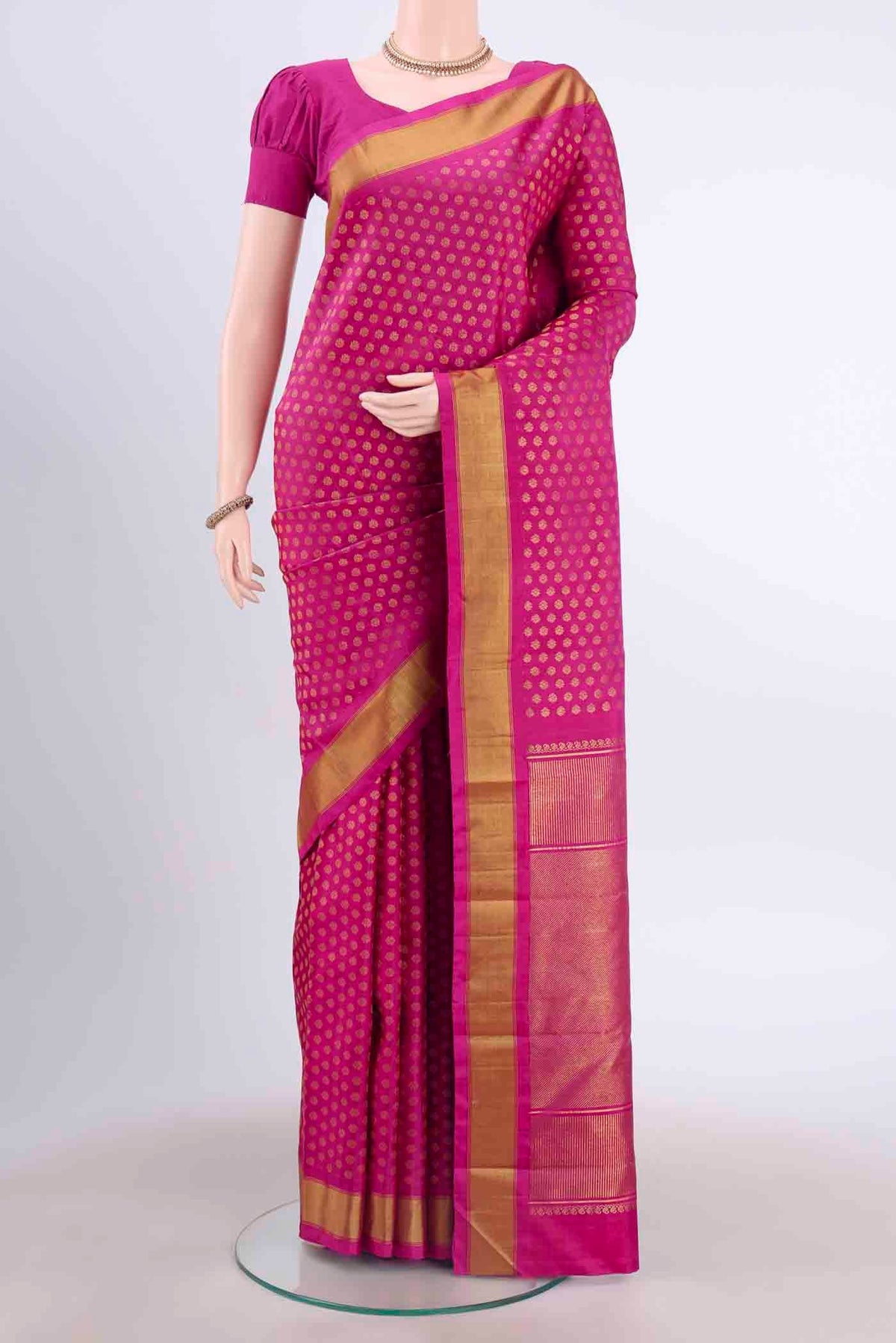 Pure Silk Pure Zari Maroon Kanchipuram Saree with Zari Butta on the body and Zari Border displayed on a mannequin