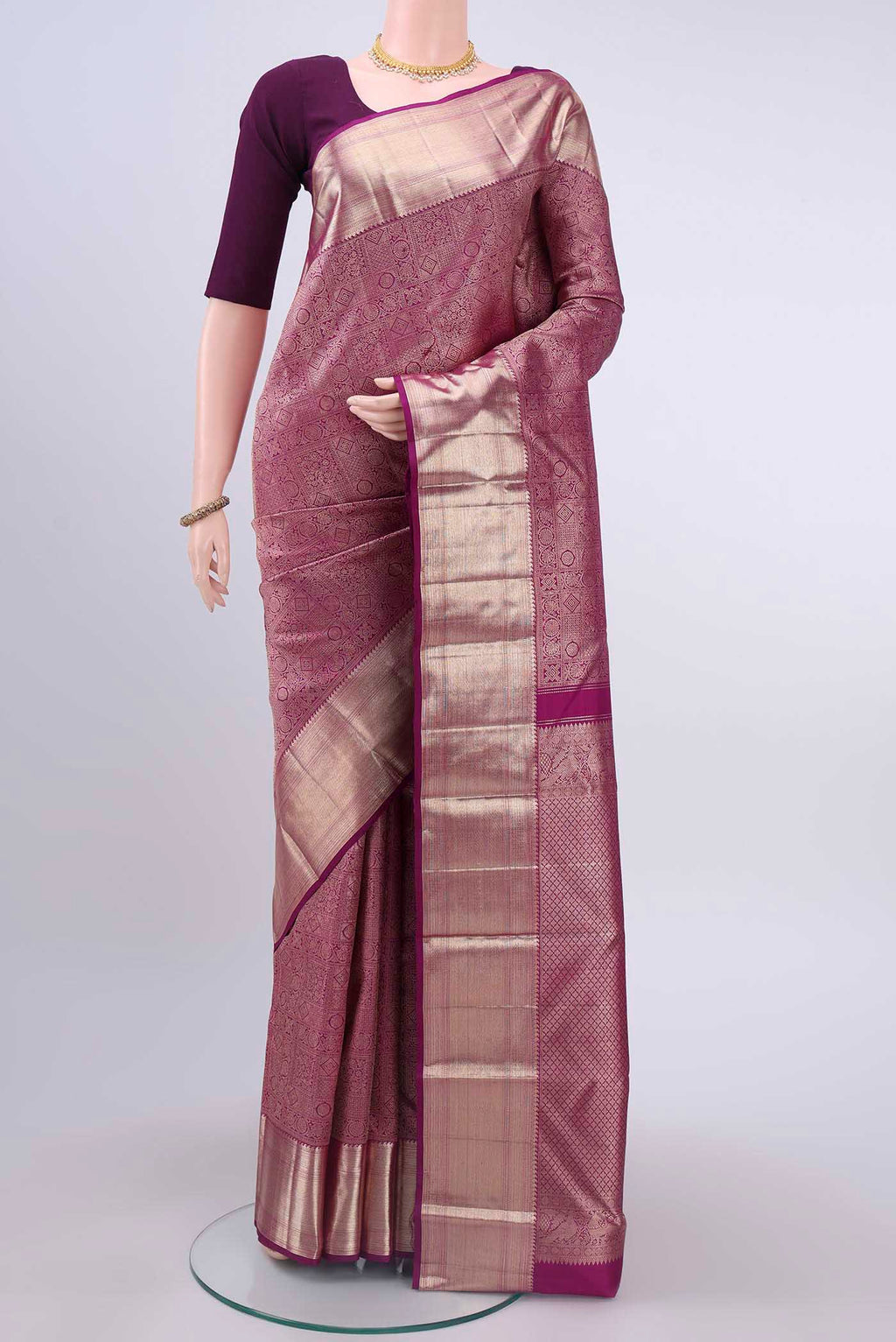 Purple Kanchipuram Saree with Zari Brocade on the body and Zari Border displayed on a mannequin