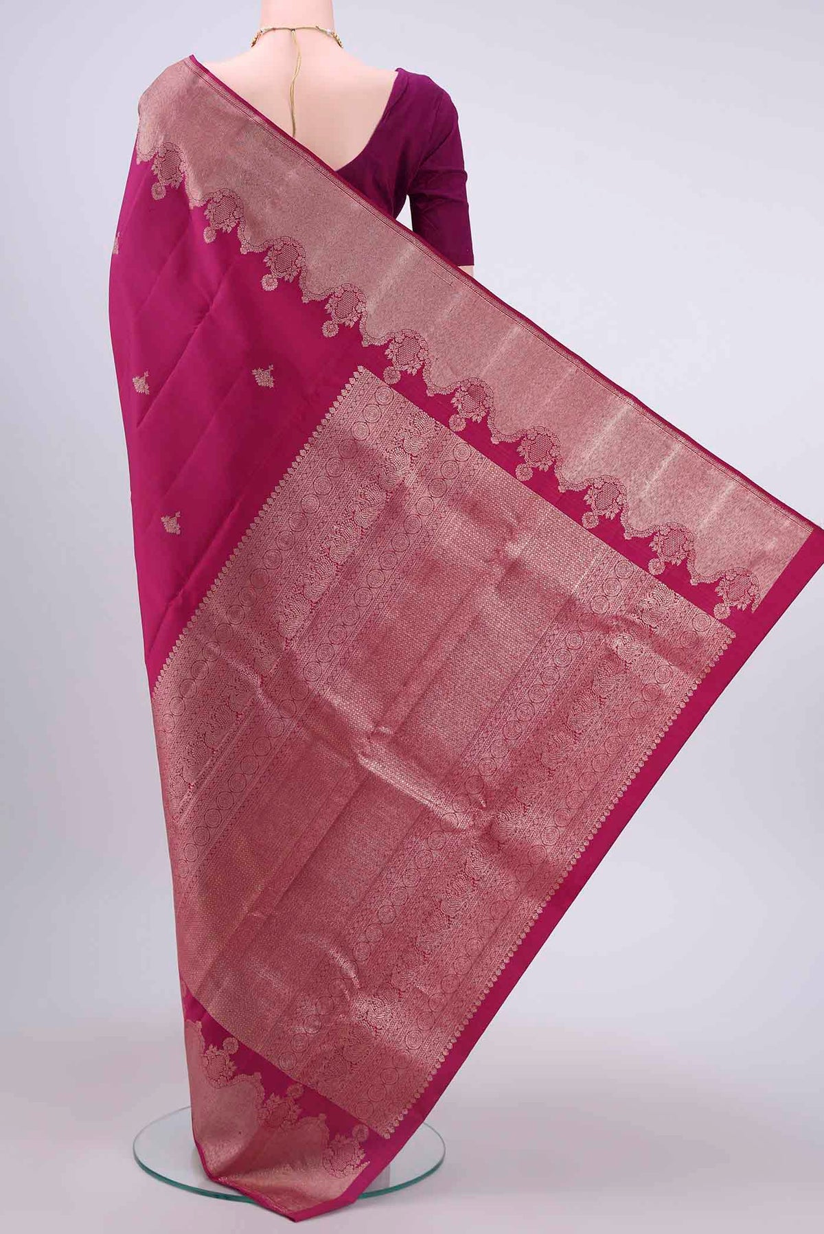 Flat view of Dark Pink Kanchipuram Saree with Zari Butta on the body and Zari Border