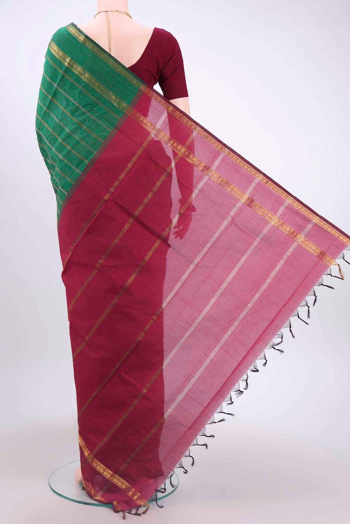Flat view of Green Blended Poly Cotton Saree with Stripes on the body and Zari Border