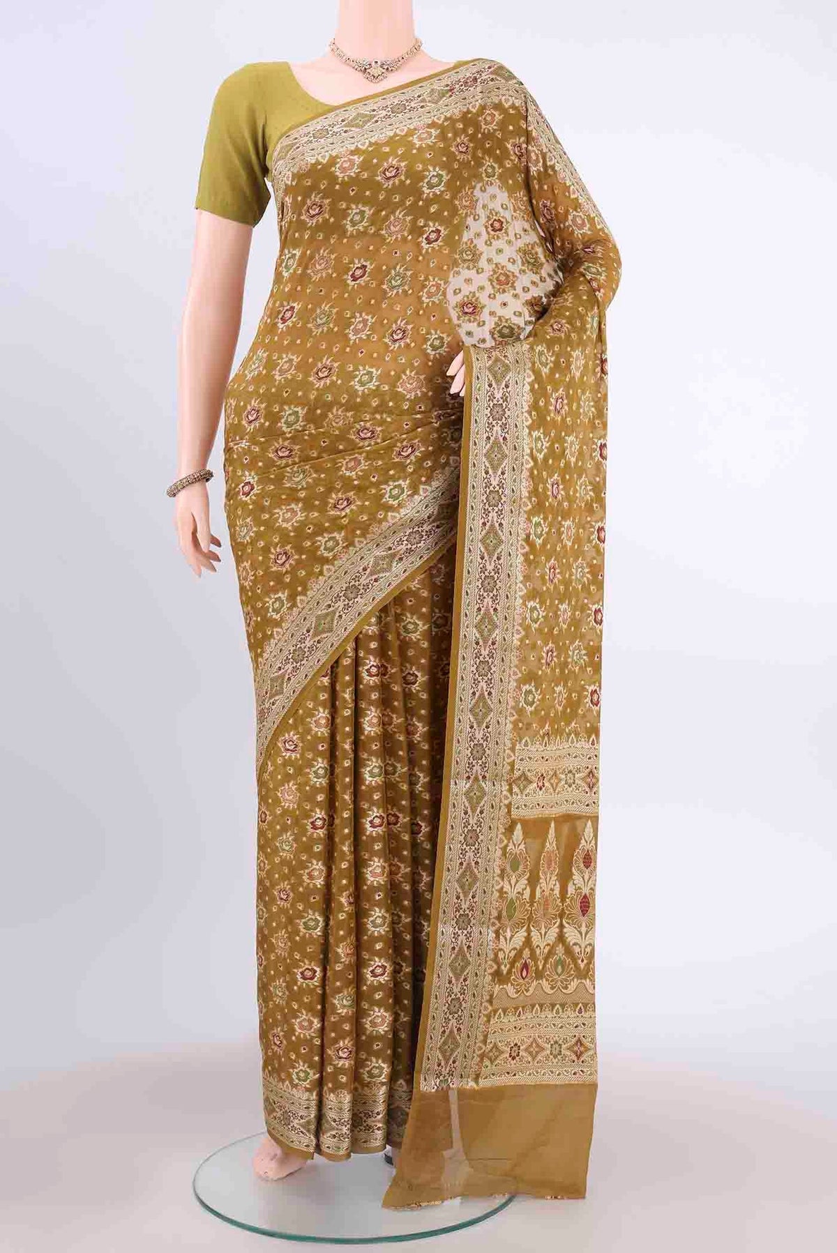 Mehandi Green Mysore Georgette Saree with Thread Brocade on the body and Thread Border displayed on a mannequin