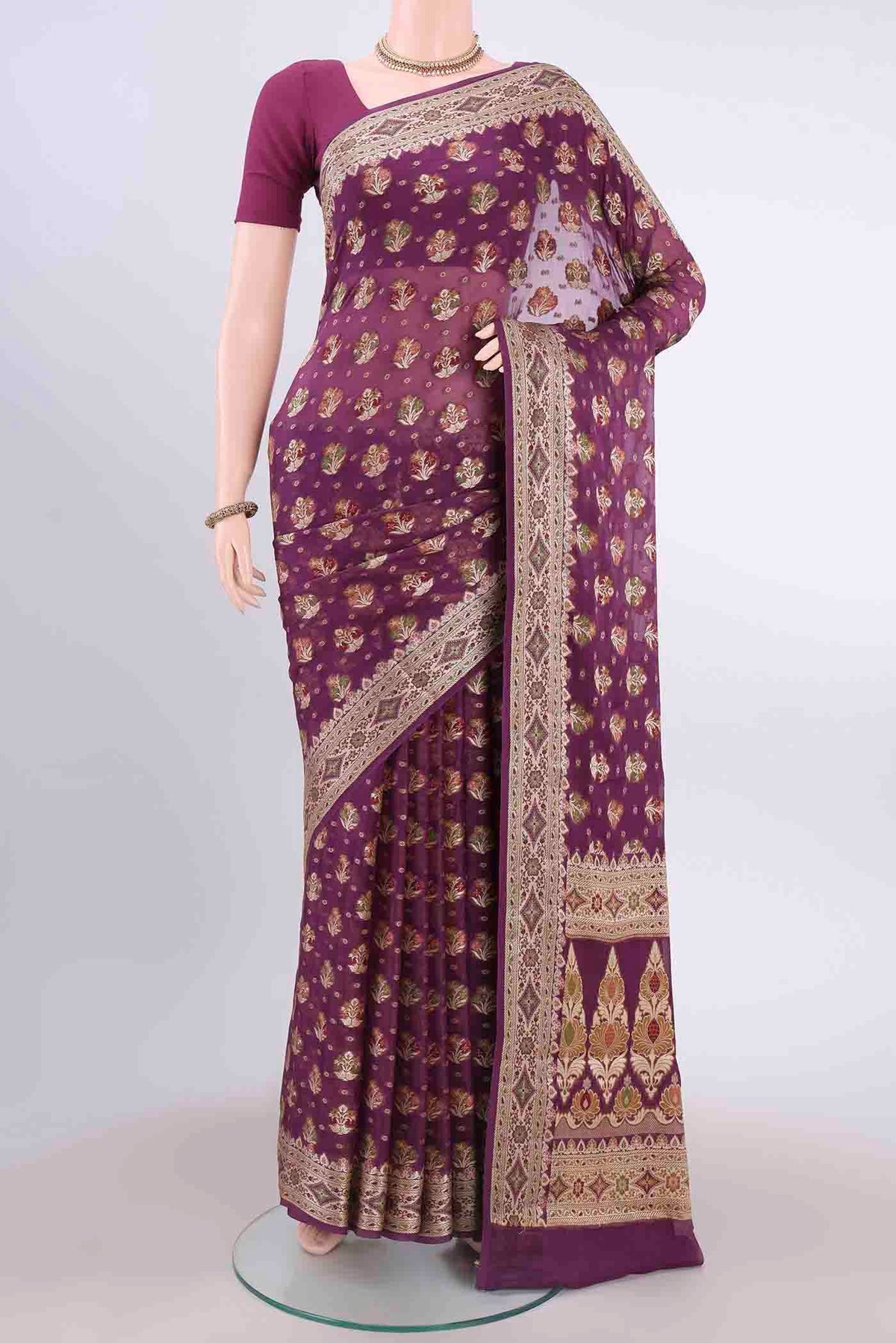 Magenta Mysore Georgette Saree with Thread Brocade on the body and Thread Border displayed on a mannequin