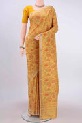 Mustard Printed Silk Saree with Floral Print on the body and Zari Border displayed on a mannequin