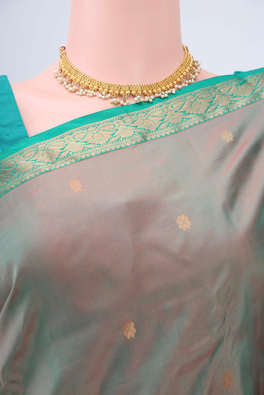 Border image of Green with Coral Color Kanchipuram Silk Saree with Zari Butta on the body and Zari Border