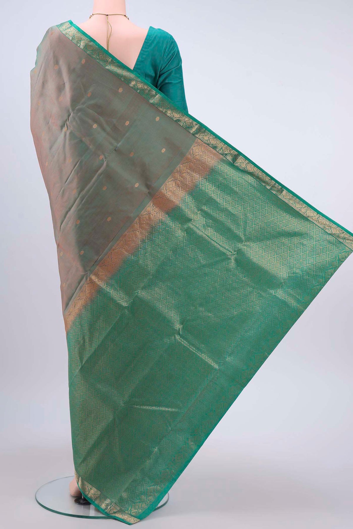 Flat view of Green with Coral Color Kanchipuram Silk Saree with Zari Butta on the body and Zari Border