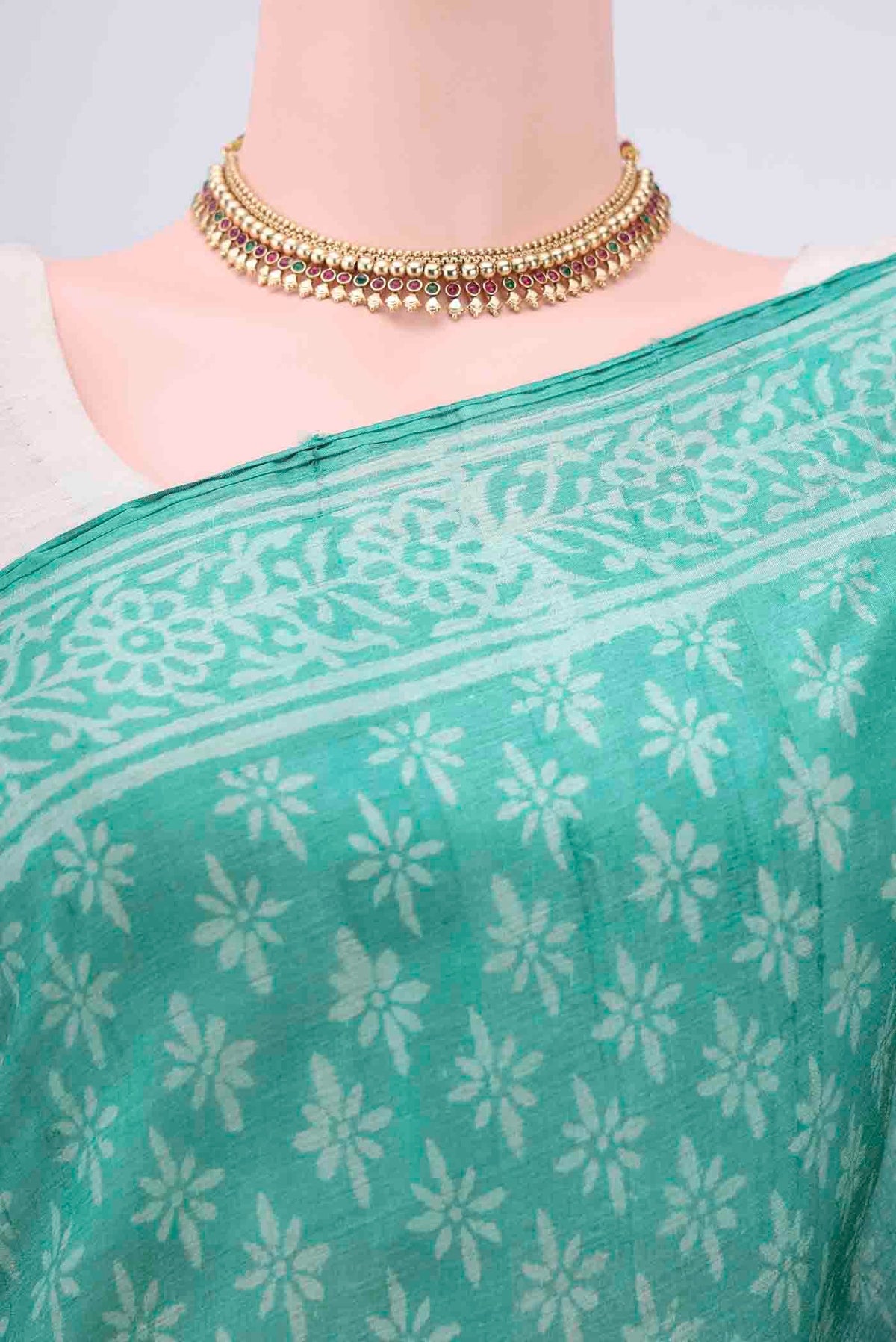 Border image of Turquoise Tussar Silk Saree with Printed design on the body and Printed Border