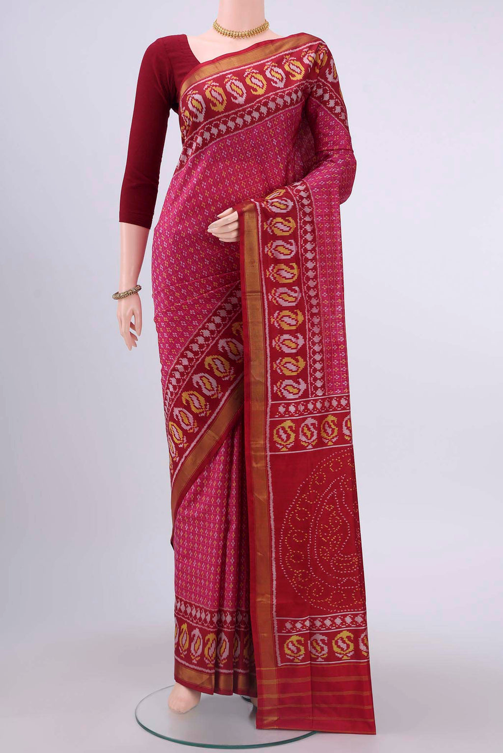 Pink Rajkot Patola Silk Saree with Pure Ikat on the body and Zari Border displayed on a mannequin